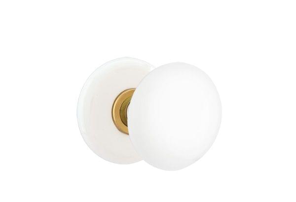 Emtek 8040IWUS7 Ice White Porcelain Knob 2-3/8" Backset Privacy with Porcelain Rose for 1-1/4" to 2" Door French Antique Brass Finish.